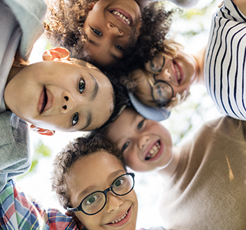 group of kids with heads together