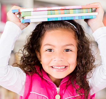 girl with books on her head