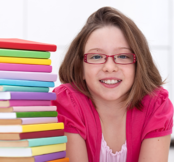 girl with a stack of books